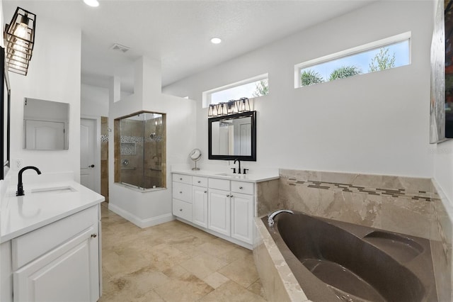 2908 Lee Shore Loop, Orlando, FL 32820 - full bath featuring two vanities, a bath, a shower stall, and recessed lighting