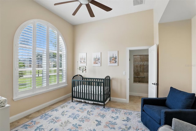 2908 Lee Shore Loop, Orlando, FL 32820 - bedroom with a crib, baseboards, and ceiling fan