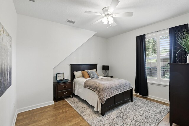 2908 Lee Shore Loop, Orlando, FL 32820 - bedroom featuring wood finished floors, baseboards, and a ceiling fan