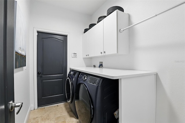 2908 Lee Shore Loop, Orlando, FL 32820 - washroom featuring cabinet space, washing machine and dryer, stone finish flooring, and baseboards