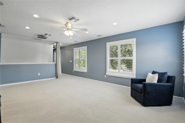 2908 Lee Shore Loop, Orlando, FL 32820 - sitting room with ceiling fan, carpet, baseboards, a textured ceiling, and recessed lighting