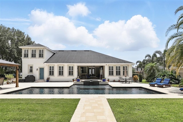 2908 Lee Shore Loop, Orlando, FL 32820 - rear view of property with a yard, stucco siding, a patio area, and a gazebo
