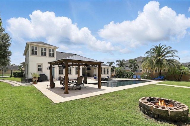 2908 Lee Shore Loop, Orlando, FL 32820 - rear view of house with a gazebo, a fire pit, a patio, and stucco siding