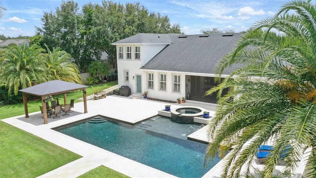 2908 Lee Shore Loop, Orlando, FL 32820 - back of property featuring a gazebo, an in-ground hot tub, a patio area, an outdoor pool, and a lawn
