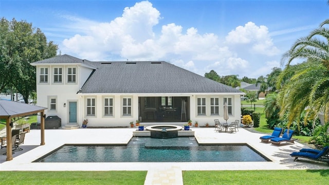 2908 Lee Shore Loop, Orlando, FL 32820 - rear view of house featuring a patio area, stucco siding, a shingled roof, entry steps, and a pool with connected hot tub