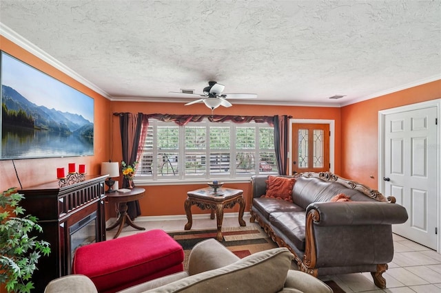 3312 SE 6th St, Ocala, FL 34471 - living room with ceiling fan, ornamental molding, tile patterned flooring, and a textured ceiling