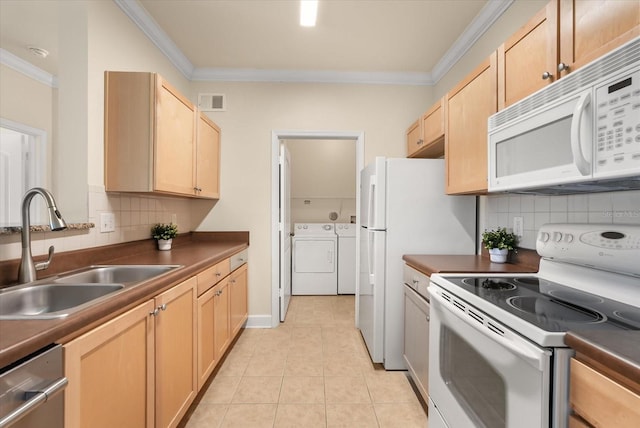 6451 Borasco Dr Unit 1603, Melbourne, FL 32940 - kitchen with white appliances, washing machine and dryer, crown molding, light brown cabinets, and dark countertops