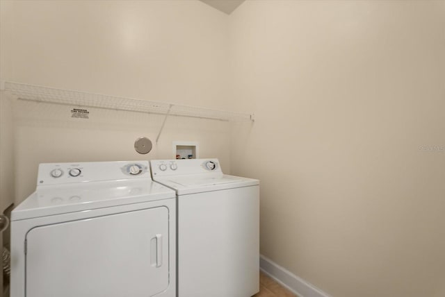 6451 Borasco Dr Unit 1603, Melbourne, FL 32940 - washroom with washer and clothes dryer and baseboards
