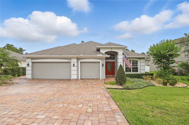405 Courtlea Park Dr, Winter Garden, FL 34787 - single story home with stucco siding, a garage, decorative driveway, a front yard, and a shingled roof