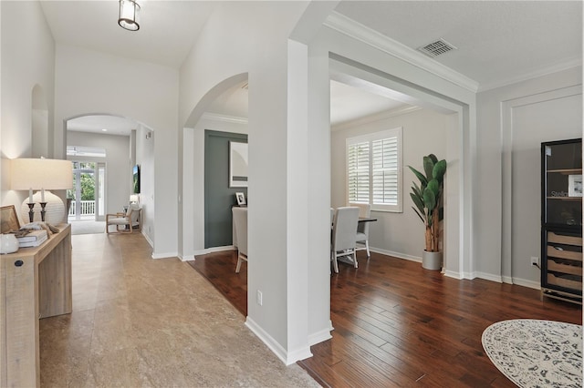 405 Courtlea Park Dr, Winter Garden, FL 34787 - entrance foyer with arched walkways, hardwood / wood-style flooring, crown molding, and baseboards