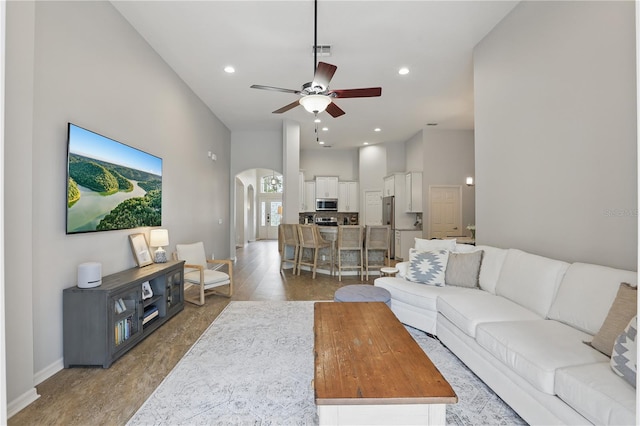405 Courtlea Park Dr, Winter Garden, FL 34787 - living area featuring arched walkways, a ceiling fan, baseboards, and recessed lighting