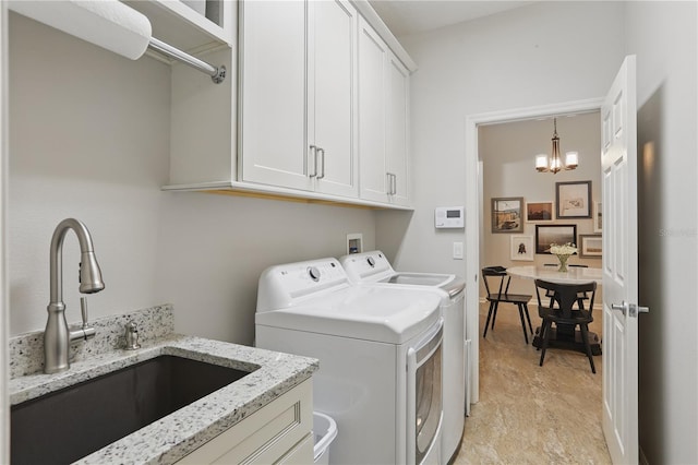 405 Courtlea Park Dr, Winter Garden, FL 34787 - laundry room featuring washer and dryer, cabinet space, and a chandelier
