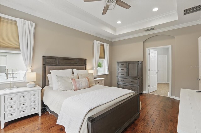 405 Courtlea Park Dr, Winter Garden, FL 34787 - bedroom with dark wood-type flooring, a tray ceiling, recessed lighting, crown molding, and a ceiling fan