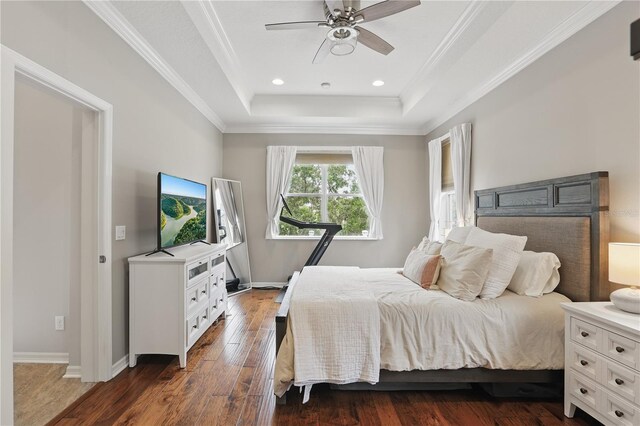405 Courtlea Park Dr, Winter Garden, FL 34787 - bedroom featuring a raised ceiling, dark wood-style flooring, crown molding, ceiling fan, and recessed lighting