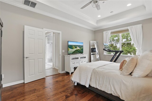 405 Courtlea Park Dr, Winter Garden, FL 34787 - bedroom featuring dark wood-style flooring, ornamental molding, a tray ceiling, baseboards, and recessed lighting