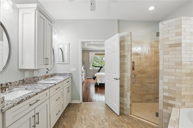405 Courtlea Park Dr, Winter Garden, FL 34787 - bathroom with ensuite bathroom, a stall shower, double vanity, a ceiling fan, and a tub