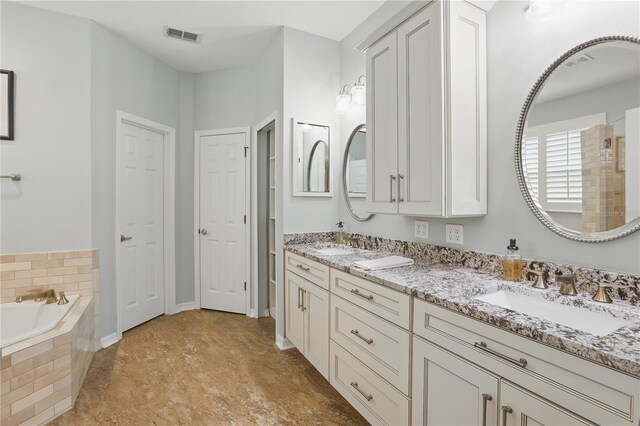405 Courtlea Park Dr, Winter Garden, FL 34787 - bathroom featuring double vanity and a bath