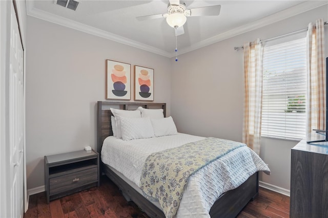 405 Courtlea Park Dr, Winter Garden, FL 34787 - bedroom featuring crown molding, dark wood finished floors, baseboards, and a ceiling fan