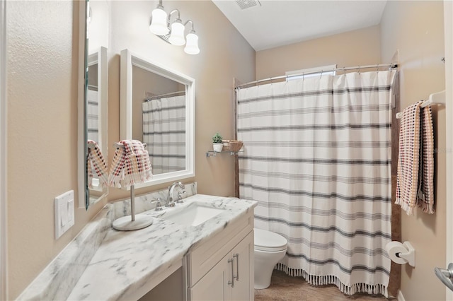 405 Courtlea Park Dr, Winter Garden, FL 34787 - bathroom with toilet, vanity, and a shower with shower curtain