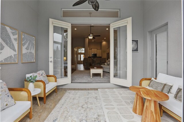 405 Courtlea Park Dr, Winter Garden, FL 34787 - living area featuring a ceiling fan, arched walkways, and french doors