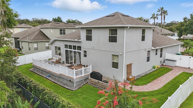 405 Courtlea Park Dr, Winter Garden, FL 34787 - rear view of property featuring stucco siding, a wooden deck, a shingled roof, and a gate