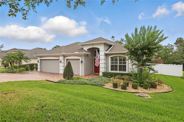405 Courtlea Park Dr, Winter Garden, FL 34787 - view of front of home with stucco siding, a garage, driveway, and roof with shingles