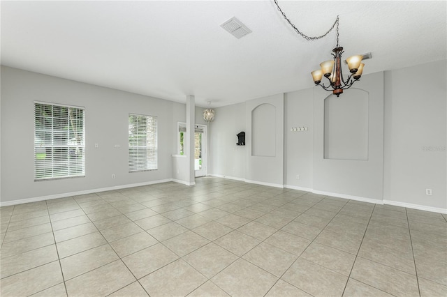 809 Kazaros Cir, Ocoee, FL 34761 - unfurnished room featuring a chandelier, light tile patterned floors, and baseboards