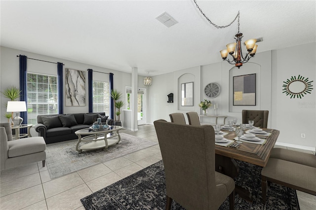 809 Kazaros Cir, Ocoee, FL 34761 - dining space featuring a chandelier, light tile patterned flooring, and baseboards