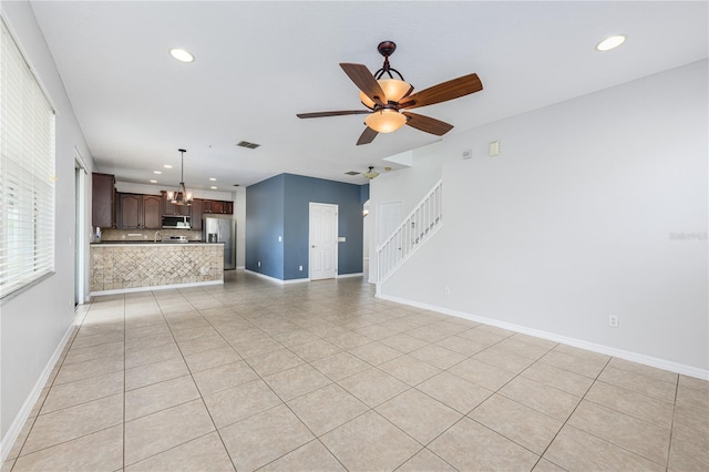 809 Kazaros Cir, Ocoee, FL 34761 - unfurnished living room with stairway, recessed lighting, a chandelier, light tile patterned flooring, and baseboards