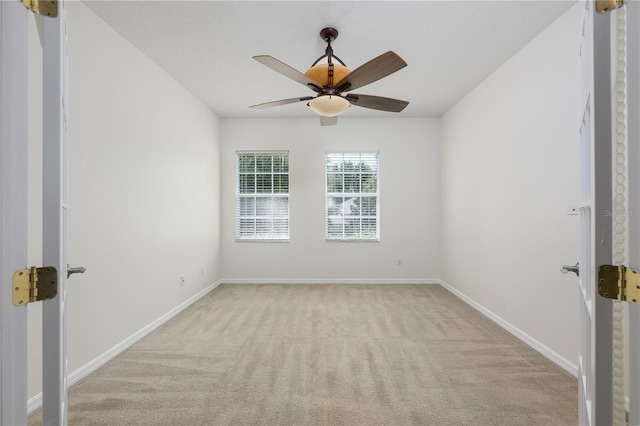 809 Kazaros Cir, Ocoee, FL 34761 - spare room featuring light colored carpet, a ceiling fan, and baseboards