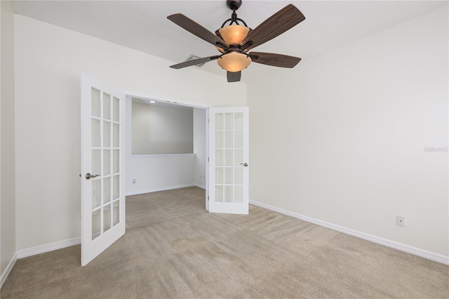 809 Kazaros Cir, Ocoee, FL 34761 - unfurnished room with french doors, light colored carpet, a ceiling fan, and baseboards