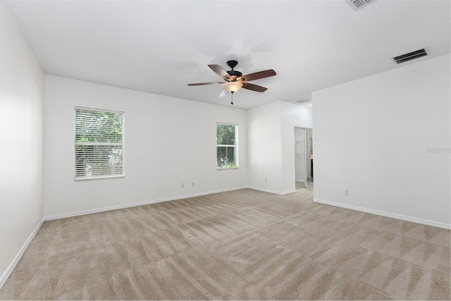 809 Kazaros Cir, Ocoee, FL 34761 - unfurnished room with healthy amount of natural light, light carpet, ceiling fan, and baseboards