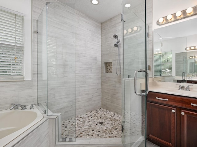 809 Kazaros Cir, Ocoee, FL 34761 - bathroom featuring a garden tub, a stall shower, and vanity