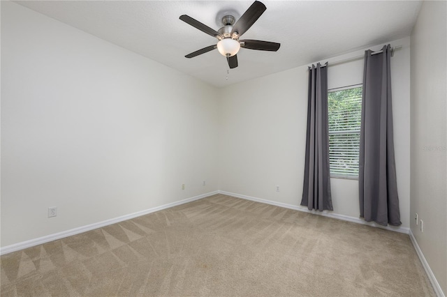 809 Kazaros Cir, Ocoee, FL 34761 - spare room featuring light carpet, a ceiling fan, and baseboards