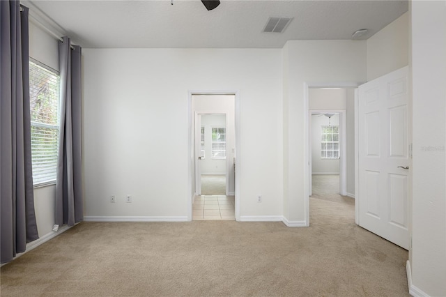 809 Kazaros Cir, Ocoee, FL 34761 - unfurnished bedroom with light carpet and baseboards