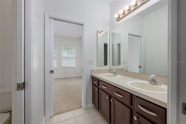 809 Kazaros Cir, Ocoee, FL 34761 - full bathroom with double vanity, tile patterned floors, and baseboards