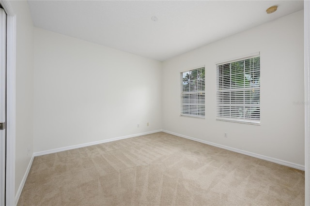 809 Kazaros Cir, Ocoee, FL 34761 - carpeted empty room with baseboards and a smoke detector