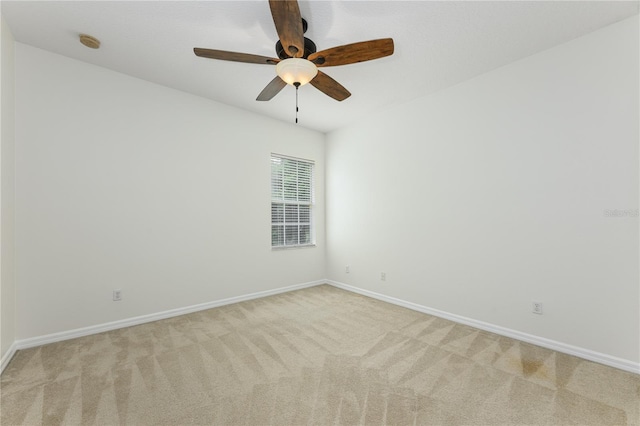 809 Kazaros Cir, Ocoee, FL 34761 - unfurnished room with light colored carpet, baseboards, a smoke detector, and a ceiling fan
