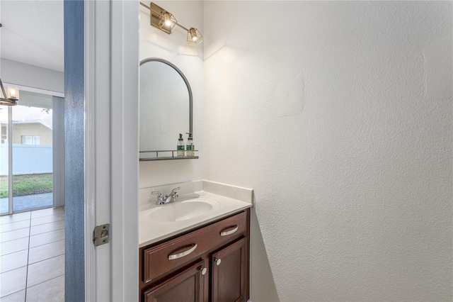 809 Kazaros Cir, Ocoee, FL 34761 - bathroom with vanity, a textured wall, and tile patterned floors