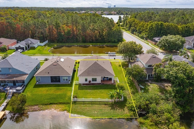 4642 Waterside Pointe Cir, Orlando, FL 32829 - aerial perspective of suburban area featuring a heavily wooded area, property boundaries highlighted, and a nearby body of water