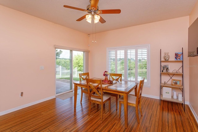 4642 Waterside Pointe Cir, Orlando, FL 32829 - dining room with wood-type flooring, baseboards, and ceiling fan