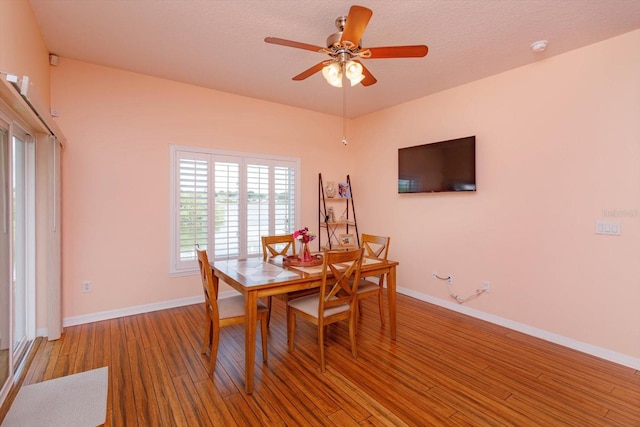 4642 Waterside Pointe Cir, Orlando, FL 32829 - dining space with wood finished floors, baseboards, and a ceiling fan