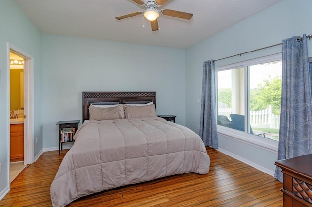 4642 Waterside Pointe Cir, Orlando, FL 32829 - bedroom featuring wood finished floors, baseboards, and ceiling fan