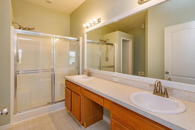 4642 Waterside Pointe Cir, Orlando, FL 32829 - full bathroom featuring a shower stall, double vanity, and tile patterned floors