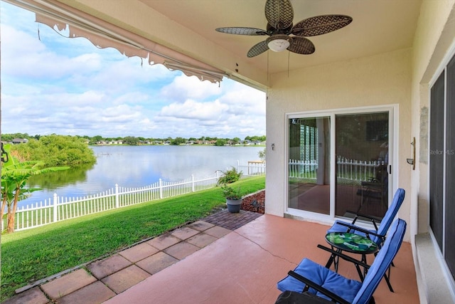 4642 Waterside Pointe Cir, Orlando, FL 32829 - view of patio / terrace featuring a ceiling fan and a water view