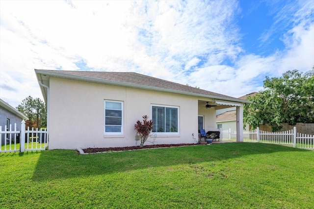 4642 Waterside Pointe Cir, Orlando, FL 32829 - rear view of property with a ceiling fan, stucco siding, and a patio
