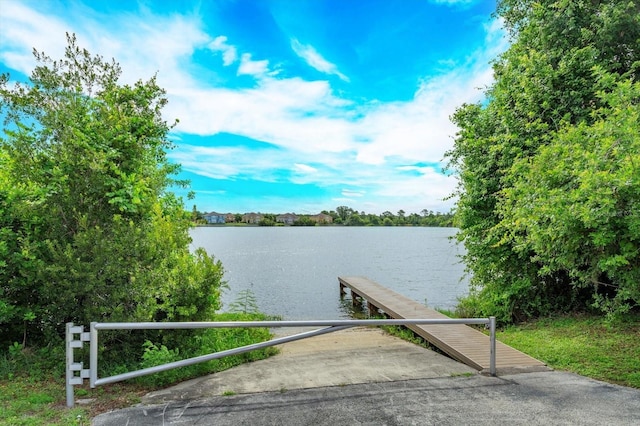 4642 Waterside Pointe Cir, Orlando, FL 32829 - dock featuring a boat ramp and a water view