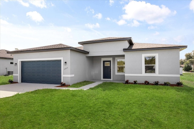 14915 SW 39th Cir, Ocala, FL 34473 - prairie-style home featuring driveway, an attached garage, a front lawn, and stucco siding