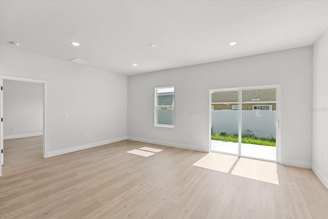 14915 SW 39th Cir, Ocala, FL 34473 - spare room with light wood-style flooring, baseboards, recessed lighting, and a smoke detector