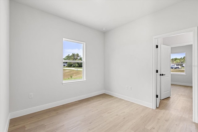 14915 SW 39th Cir, Ocala, FL 34473 - unfurnished room with light wood finished floors and baseboards